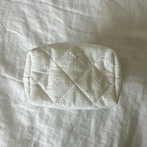 White eyelet quilted make up bag